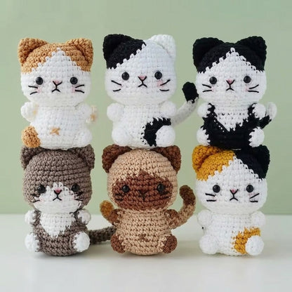 WoolyArtis Tiny Crochet Cat Plushie keychain charm, handmade amigurumi kitten with soft yarn and detailed crochet features.