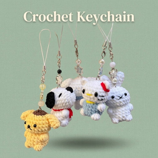 Handmade WoolyArtis Crochet Hello Kitty keychain with plush amigurumi design, perfect as a cute bag charm or accessory.